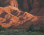 Painting by Brenda Howell of early morning dramatic light on red hills and cliffs in Capital Reef National Park. 